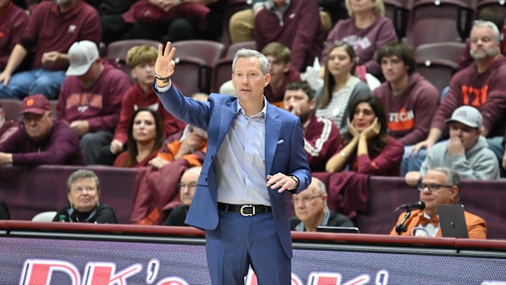 Dec 31, 2025; Blacksburg, Virginia, USA; Virginia Cavaliers head coach Ryan Odom gives his team instructions during the third overtime at Cassell Coliseum. Mandatory Credit: Brian Bishop-Imagn Images Dec 31, 2025; Blacksburg, Virginia, USA; Virginia Cavaliers head coach Ryan Odom gives his team instructions during the third overtime at Cassell Coliseum. Mandatory Credit: Brian Bishop-Imagn Images