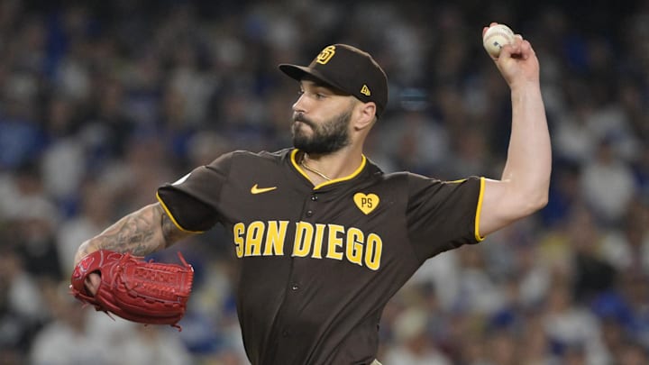 Oct 6, 2024; Los Angeles, California, USA; San Diego Padres pitcher Tanner Scott (66) pitches against the Los Angeles Dodgers in the eighth inning during game two of the NLDS for the 2024 MLB Playoffs at Dodger Stadium. Mandatory Credit: Jayne Kamin-Oncea-Imagn Images