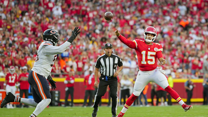 Kansas City Chiefs quarterback Patrick Mahomes (15) throws a pass against Chicago Bears defensive end Dayo Odeyingbo (55). Mandatory Credit: Jay Biggerstaff-Imagn Images