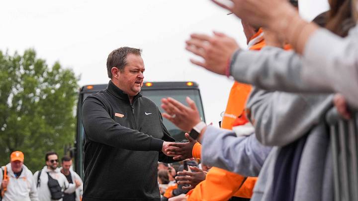 Tennessee coach Josh Heupel high-fives fans as the Tennessee football team arrives at Kroger Field for a NCAA football game against Kentucky in Lexington, Kentucky on Oct. 25, 2025.
