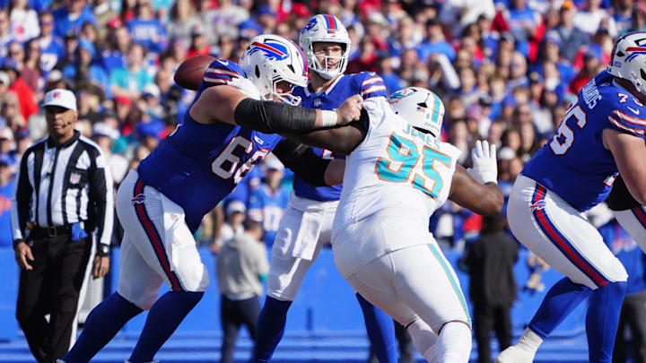 Buffalo Bills guard Connor McGovern (66) blocks Miami Dolphins defensive tackle Benito Jones (95) during the first half at Highmark Stadium in Week 9. Buffalo Bills guard Connor McGovern (66) blocks Miami Dolphins defensive tackle Benito Jones (95) during the first half at Highmark Stadium in Week 9.