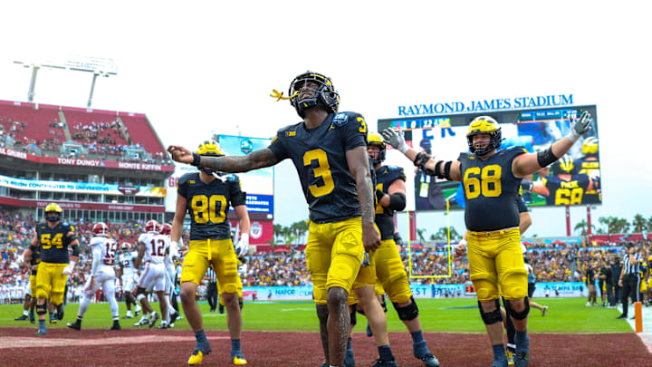 Dec 31, 2024; Tampa, FL, USA; Michigan Wolverines wide receiver Fredrick Moore (3) celebrates after scoring  a touchdown against the Alabama Crimson Tide in the first quarter during the ReliaQuest Bowl at Raymond James Stadium. Mandatory Credit: Nathan Ray Seebeck-Imagn Images
