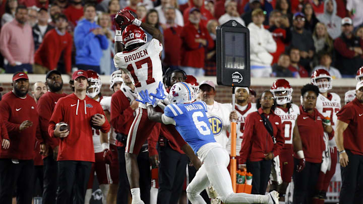 Oct 7, 2023; Oxford, Mississippi, USA; Arkansas Razorbacks wide receiver Tyrone Broden (17) catches the ball as Mississippi Rebels defensive back Zamari Walton (6) defends during the second half at Vaught-Hemingway Stadium. Mandatory Credit: Petre Thomas-USA TODAY Sports