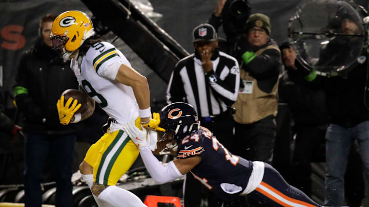 Green Bay Packers wide receiver Christian Watson (9) scores a touchdown against Chicago Bears cornerback Nick McCloud (24) during their wild-card playoff football game Saturday, January 10, 2026, at Soldier Field in Chicago, Illinois. Green Bay Packers wide receiver Christian Watson (9) scores a touchdown against Chicago Bears cornerback Nick McCloud (24) during their wild-card playoff football game Saturday, January 10, 2026, at Soldier Field in Chicago, Illinois.