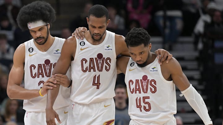 Jan 14, 2023; Minneapolis, Minnesota, USA; Cleveland Cavaliers forward Evan Mobley (4) is helped off the court by guard Donovan Mitchell (45) and center Jarrett Allen (31) during the second quarter at Target Center. Mandatory Credit: Jeffrey Becker-Imagn Images