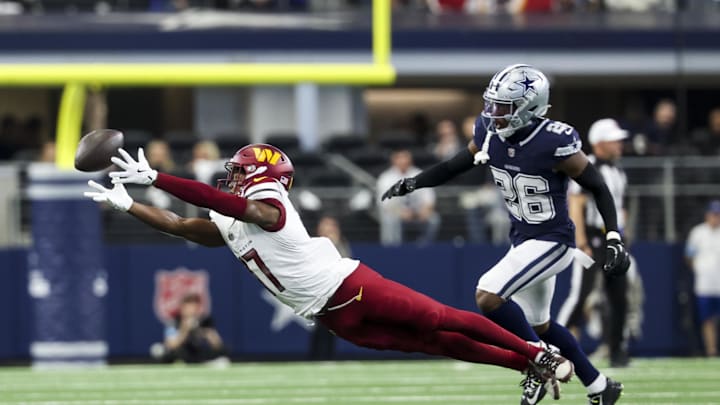 Jan 5, 2025; Arlington, Texas, USA;  Washington Commanders wide receiver Terry McLaurin (17) dives for but cannot make a catch in front of Dallas Cowboys cornerback DaRon Bland (26) during the first quarter at AT&T Stadium. Mandatory Credit: Kevin Jairaj-Imagn Images