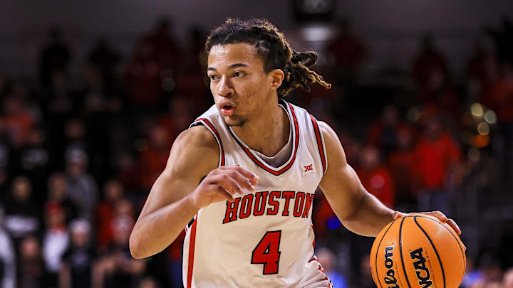 Jan 3, 2026; Cincinnati, Ohio, USA; Houston Cougars guard Kingston Flemings (4) dribbles against the Cincinnati Bearcats in the first half at Fifth Third Arena. Mandatory Credit: Katie Stratman-Imagn Images