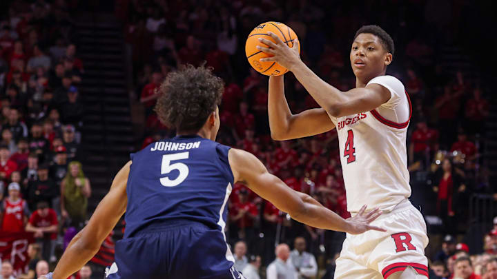 Dec 10, 2024; Piscataway, New Jersey, USA;  Rutgers Scarlet Knights guard Ace Bailey (4) looks to pass as Penn State Nittany Lions guard Puff Johnson (5) defends during the second half at Jersey Mike's Arena. Mandatory Credit: Vincent Carchietta-Imagn Images
