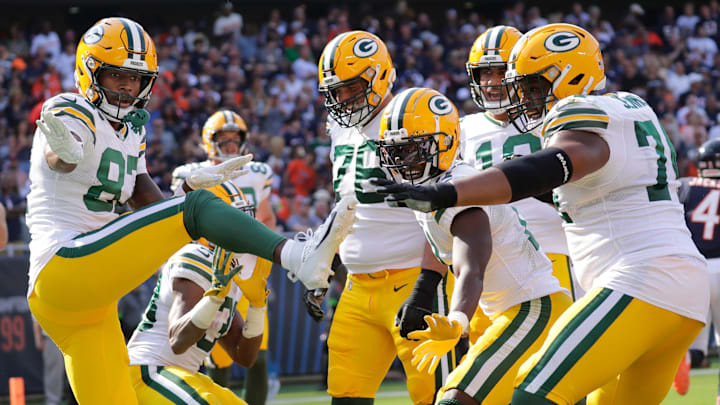 Green Bay Packers wide receiver Romeo Doubs (87) celebrates with teammates after scoring at Chicago last week.