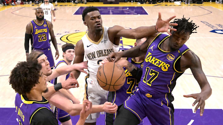 Apr 4, 2025; Los Angeles, California, USA;  Los Angeles Lakers center Jaxson Hayes (11), New Orleans Pelicans forward Kelly Olynyk (13), New Orleans Pelicans center Yves Missi (21) and Los Angeles Lakers forward Dorian Finney-Smith (17) battle for a loose ball under the basket in the first half at Crypto.com Arena. Mandatory Credit: Jayne Kamin-Oncea-Imagn Images