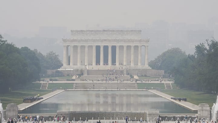 Jun 29, 2023; Washington, D.C., USA; The Lincoln Memorial is seen in the distance through hazy and