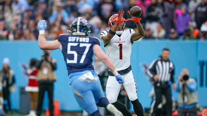 Cincinnati Bengals wide receiver Ja'Marr Chase (1)catches a pass as Tennessee Titans linebacker Luke Gifford (57) pursues during the second quarter at Nissan Stadium in Nashville, Tenn., Sunday, Dec. 15, 2024.
