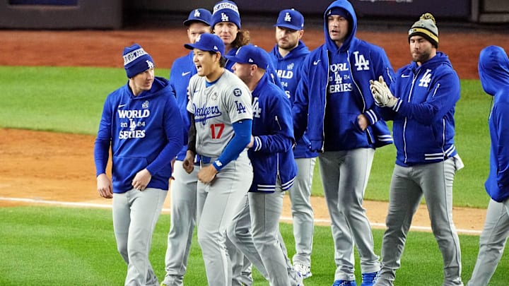 Oct 28, 2024; New York, New York, USA; Los Angeles Dodgers two-way player Shohei Ohtani (17) celebrates with his teammates after defeating the New York Yankees in game three of the 2024 MLB World Series at Yankee Stadium. Mandatory Credit: Robert Deutsch-Imagn Images