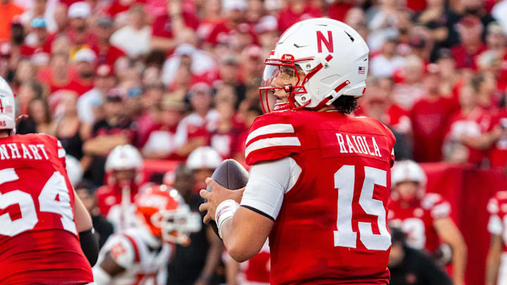 Sep 20, 2024; Lincoln, Nebraska, USA; Nebraska Cornhuskers quarterback Dylan Raiola (15) drops to throw against the Illinois Fighting Illini during the first quarter at Memorial Stadium. Mandatory Credit: Dylan Widger-Imagn Images