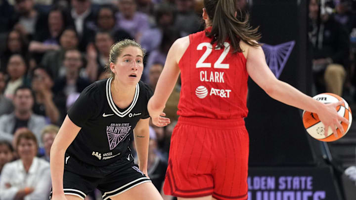 Golden State Valkyries guard Kate Martin (left) defends against Indiana Fever guard Caitlin Clark (22) during the second quarter at Chase Center. 