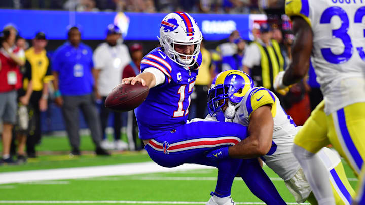Sep 8, 2022; Inglewood, California, USA; Buffalo Bills quarterback Josh Allen (17) scores a touchdown on Los Angeles Rams linebacker Bobby Wagner (45) in the fourth quarter at SoFi Stadium. Mandatory Credit: Gary A. Vasquez-Imagn Images