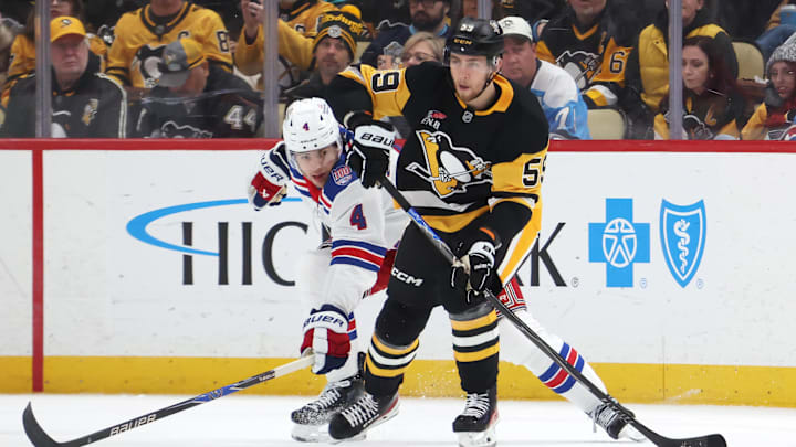 Jan 31, 2026; Pittsburgh, Pennsylvania, USA; Pittsburgh Penguins right wing Egor Chinakhov (59) moves the puck against New York Rangers defenseman Braden Schneider (4) during the second period at PPG Paints Arena. Mandatory Credit: Charles LeClaire-Imagn Images Jan 31, 2026; Pittsburgh, Pennsylvania, USA; Pittsburgh Penguins right wing Egor Chinakhov (59) moves the puck against New York Rangers defenseman Braden Schneider (4) during the second period at PPG Paints Arena. Mandatory Credit: Charles LeClaire-Imagn Images