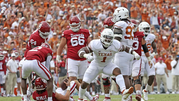 Oct 8, 2022; Dallas, Texas, USA;  Texas Longhorns defensive end Justice Finkley (1) reacts after a sack of Oklahoma Sooners quarterback Davis Beville (11) during the second half at the Cotton Bowl. Mandatory Credit: Kevin Jairaj-Imagn Images