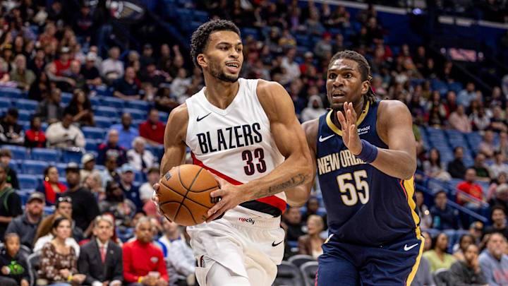 Nov 12, 2025; New Orleans, Louisiana, USA;  
Portland Trail Blazers forward Toumani Camara (33) dribbles against New Orleans Pelicans forward Kevon Looney (55) during the first half at Smoothie King Center. Mandatory Credit: Stephen Lew-Imagn Images