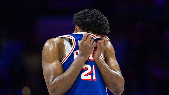 Feb 20, 2025; Philadelphia, Pennsylvania, USA; Philadelphia 76ers center Joel Embiid (21) wipes his face during a break in the third quarter against the Boston Celtics at Wells Fargo Center. Mandatory Credit: Bill Streicher-Imagn Images