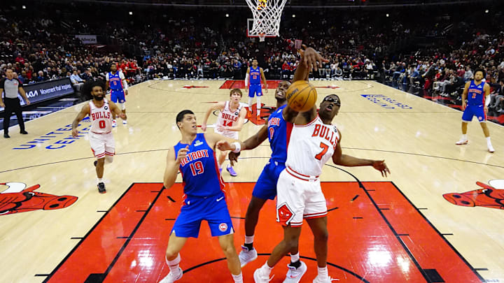 Feb 11, 2025; Chicago, Illinois, USA; Detroit Pistons center Jalen Duren (0) and Chicago Bulls forward Jalen Smith (7) go for the ball during the first half at United Center. Mandatory Credit: David Banks-Imagn Images