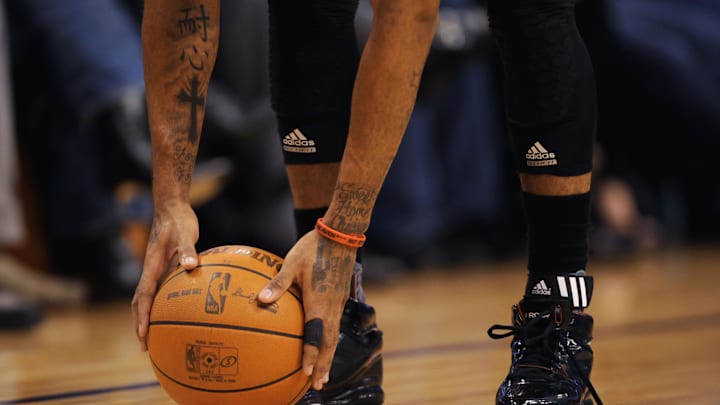 Nov. 24, 2010; Phoenix, AZ, USA; Detailed view of the shoes of Chicago Bulls guard Derrick Rose as he picks up a basketball against the Phoenix Suns at the US Airways Center. The Bulls defeated the Suns 123-115 in double overtime. Mandatory Credit: Mark J. Rebilas-Imagn Images