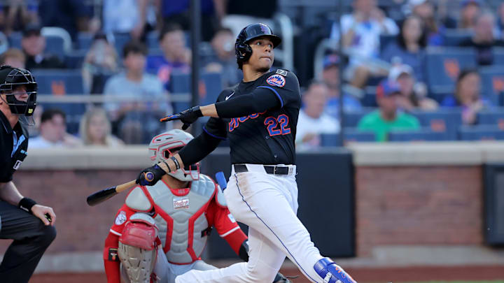 New York Mets right fielder Juan Soto (22) follows through on a solo home run against the Cincinnati Reds during the first inning at Citi Field on July 18. 