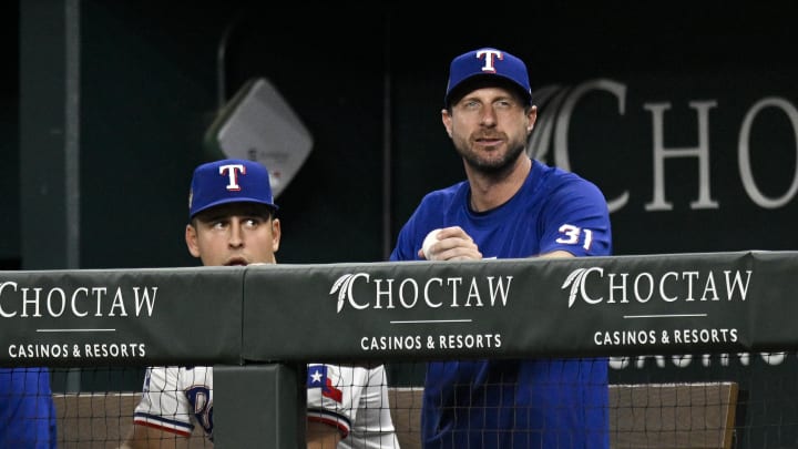 Jun 3, 2024; Arlington, Texas, USA; Texas Rangers starting pitcher Max Scherzer (31) watches from the dugout during the sixth inning against the Detroit Tigers at Globe Life Field. Jun 3, 2024; Arlington, Texas, USA; Texas Rangers starting pitcher Max Scherzer (31) watches from the dugout during the sixth inning against the Detroit Tigers at Globe Life Field.