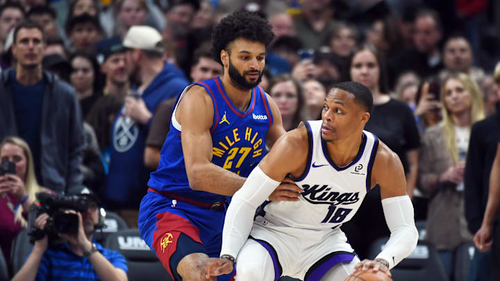 Nov 22, 2025; Denver, Colorado, USA; Sacramento Kings guard Russell Westbrook (18) handles the ball against Denver Nuggets guard Jamal Murray (27) during the first half at Ball Arena. Mandatory Credit: Christopher Hanewinckel-Imagn Images