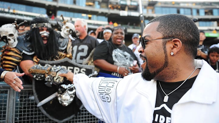 September 14, 2009; Oakland, CA, USA; American rapper Ice Cube (right) acknowledges the fans before the game between the San Diego Chargers and the Oakland Raiders at Oakland-Alameda County Coliseum. Mandatory Credit: Kyle Terada-Imagn Images
