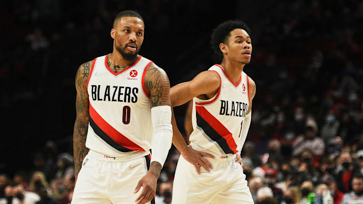 Portland Trail Blazers guard Damian Lillard (0) and guard Anfernee Simons.