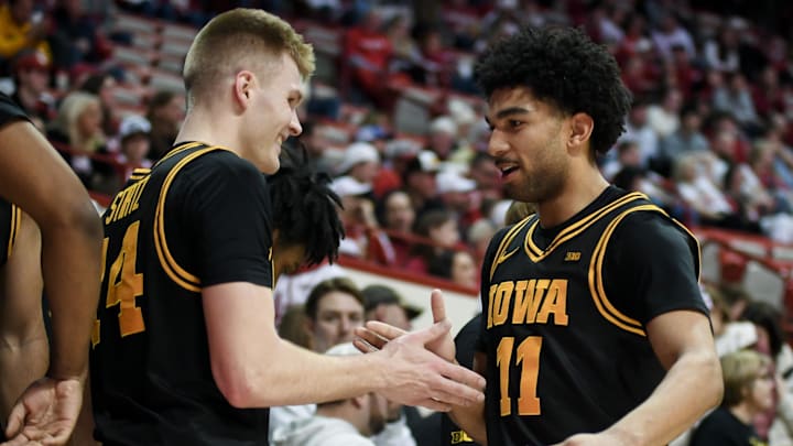 Jan 17, 2026; Bloomington, Indiana, USA; Iowa Hawkeyes guard Bennett Stirtz (14) high-fives Iowa Hawkeyes guard Kael Combs (11) after checking out of the game against the Indiana Hoosiers during the second half at Simon Skjodt Assembly Hall. Mandatory Credit: Robert Goddin-Imagn Images