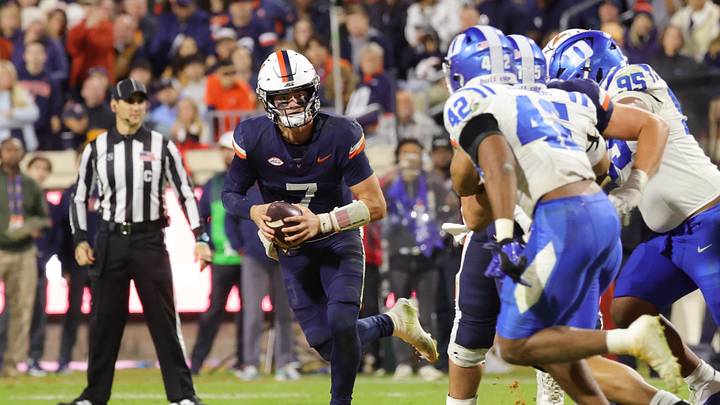 Oct 23, 2026; Charlottesville, Virginia, USA; Virginia Cavaliers quarterback Beau Pribula (7) runs with the ball as Duke Blue Devils linebacker Kendall Johnson (42) defends during the second half at Scott Stadium. Mandatory Credit: Amber Searls-Imagn Images Oct 23, 2026; Charlottesville, Virginia, USA; Virginia Cavaliers quarterback Beau Pribula (7) runs with the ball as Duke Blue Devils linebacker Kendall Johnson (42) defends during the second half at Scott Stadium. Mandatory Credit: Amber Searls-Imagn Images