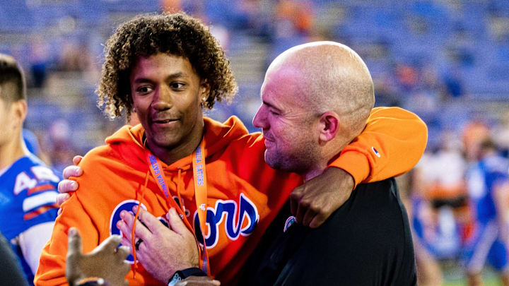 Florida Gators offensive coordinator Rob Sale hugs Florida Gators recruit Jaden Rashada after the game against the South Carolina Gamecocks at Steve Spurrier Field at Ben Hill Griffin Stadium in Gainesville, FL on Saturday, November 12, 2022. [Matt Pendleton/Gainesville Sun]

Ncaa Football Florida Gators Vs South Carolina Gamecocks