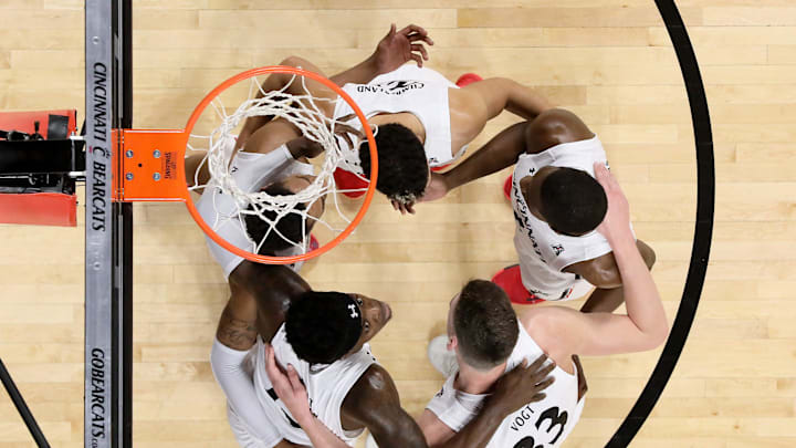 Cincinnati Bearcats guard Mika Adams-Woods (3), guard Jarron Cumberland (34), guard Keith Williams Cincinnati Bearcats guard Mika Adams-Woods (3), guard Jarron Cumberland (34), guard Keith Williams