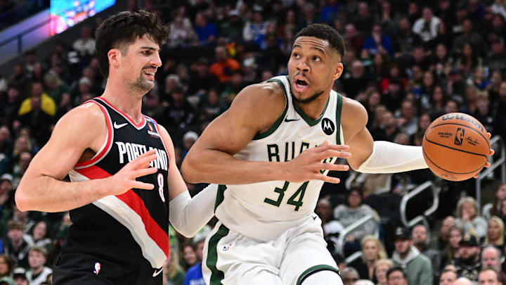 Jan 4, 2025; Milwaukee, Wisconsin, USA; Milwaukee Bucks forward Giannis Antetokounmpo (34) drives for the basket against Portland Trail Blazers forward Deni Avdija (8) in the fourth quarter at Fiserv Forum. Mandatory Credit: Benny Sieu-Imagn Images Jan 4, 2025; Milwaukee, Wisconsin, USA; Milwaukee Bucks forward Giannis Antetokounmpo (34) drives for the basket against Portland Trail Blazers forward Deni Avdija (8) in the fourth quarter at Fiserv Forum. Mandatory Credit: Benny Sieu-Imagn Images