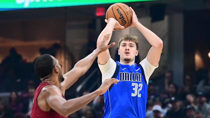 Mar 15, 2026; Cleveland, Ohio, USA; Dallas Mavericks forward Cooper Flagg (32) shoots over the defense of Cleveland Cavaliers center Evan Mobley (4) during the first half at Rocket Arena. Mar 15, 2026; Cleveland, Ohio, USA; Dallas Mavericks forward Cooper Flagg (32) shoots over the defense of Cleveland Cavaliers center Evan Mobley (4) during the first half at Rocket Arena.