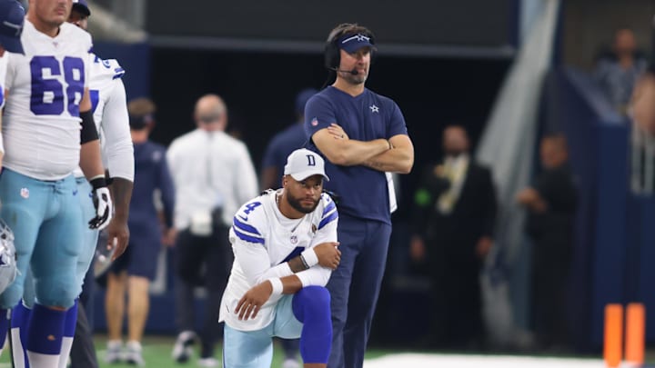 Aug 12, 2023; Arlington, Texas, USA; Dallas Cowboys quarterback Dak Prescott (4) and offensive coordinator  Brian Schottenheimer watch a play in the game against the Jacksonville Jaguars at AT&T Stadium. Mandatory Credit: Tim Heitman-Imagn Images