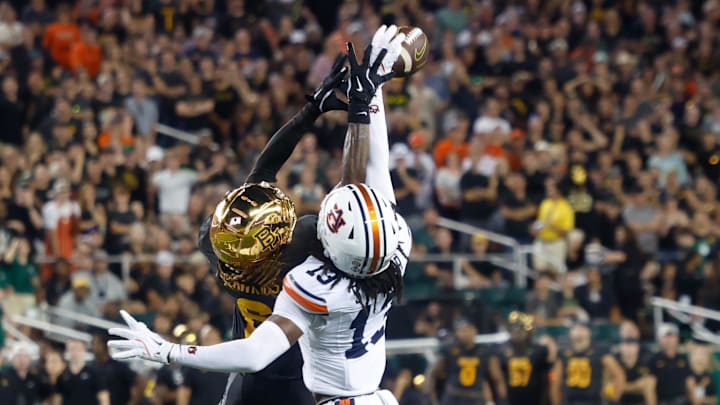 Aug 29, 2025; Waco, Texas, USA; Auburn Tigers cornerback Raion Strader (13) breaks up a pass intended for Baylor Bears wide receiver Ashtyn Hawkins (6) during the first half at McLane Stadium. Mandatory Credit: Chris Jones-Imagn Images