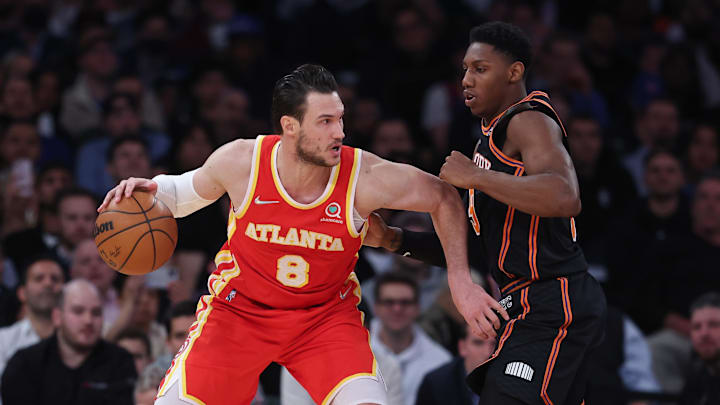 Mar 22, 2022; New York, New York, USA; Atlanta Hawks forward Danilo Gallinari (8) dribbles toward the basket against New York Knicks guard RJ Barrett (9) during the second half at Madison Square Garden. Mandatory Credit: Vincent Carchietta-Imagn Images