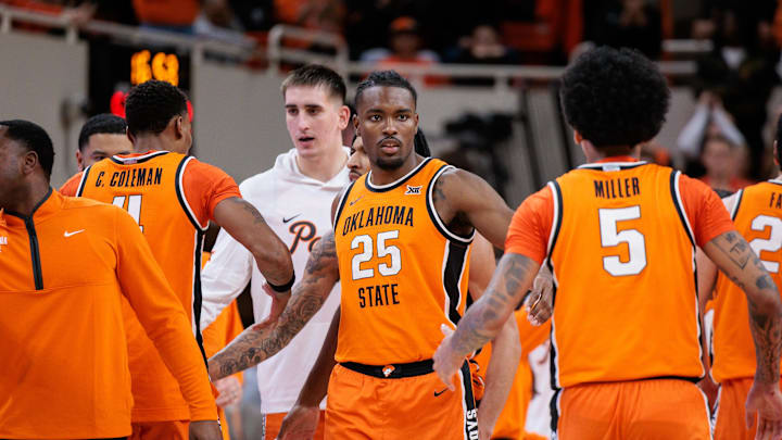 Nov 9, 2025; Stillwater, Oklahoma, USA; Oklahoma State Cowboys forward Robert Jennings (25) celebrates with teammates during the second half against the Texas A&M Aggies at Gallagher-Iba Arena. Mandatory Credit: William Purnell-Imagn Images