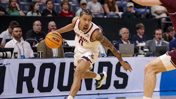Mar 19, 2026; Oklahoma City, OK, USA; Saint Mary's (CA) Gaels guard Mikey Lewis (0) dribbles the ball during a first round game of the men's 2026 NCAA Tournament at Paycom Center. 