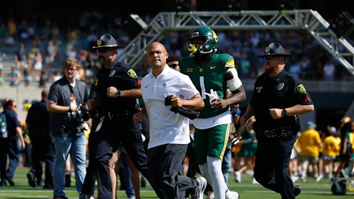 Sep 13, 2025; Waco, Texas, USA;  Baylor Bears head coach Dave Aranda takes the field before opening kick against the Samford Bulldogs at McLane Stadium. Mandatory Credit: Chris Jones-Imagn Images