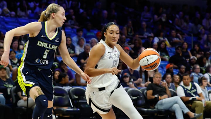 Jul 16, 2025; Arlington, Texas, USA; Las Vegas Aces guard Aaliyah Nye (13) drives to the basket as Dallas Wings guard Paige Bueckers (5) defends during the first half at College Park Center. Mandatory Credit: Chris Jones-Imagn Images Jul 16, 2025; Arlington, Texas, USA; Las Vegas Aces guard Aaliyah Nye (13) drives to the basket as Dallas Wings guard Paige Bueckers (5) defends during the first half at College Park Center. Mandatory Credit: Chris Jones-Imagn Images