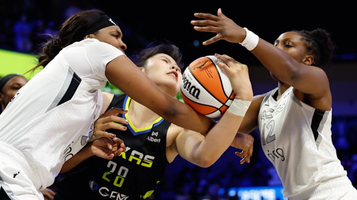 Jul 27, 2025; Arlington, Texas, USA; Dallas Wings center Li Yueru (28) is fouled by Las Vegas Aces forward NaLyssa Smith (3) during the second half at College Park Center. Jul 27, 2025; Arlington, Texas, USA; Dallas Wings center Li Yueru (28) is fouled by Las Vegas Aces forward NaLyssa Smith (3) during the second half at College Park Center.