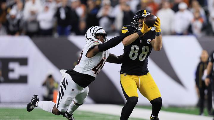 Oct 16, 2025; Cincinnati, Ohio, USA; Cincinnati Bengals linebacker Barrett Carter (49) leaps to defend against a pass intended for Pittsburgh Steelers tight end Pat Freiermuth (88) during the second half at Paycor Stadium. Mandatory Credit: Katie Stratman-Imagn Images