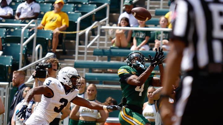 Sep 13, 2025; Waco, Texas, USA; Baylor Bears wide receiver Louis Brown IV (4) catches a touchdown pass ahead of Samford Bulldogs cornerback Caidan Maddux (3) during the second half at McLane Stadium. Mandatory Credit: Chris Jones-Imagn Images Sep 13, 2025; Waco, Texas, USA; Baylor Bears wide receiver Louis Brown IV (4) catches a touchdown pass ahead of Samford Bulldogs cornerback Caidan Maddux (3) during the second half at McLane Stadium. Mandatory Credit: Chris Jones-Imagn Images