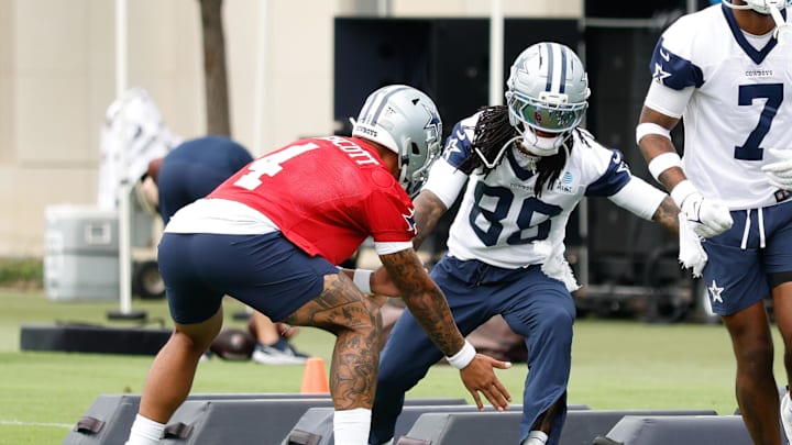 Jun 10, 2025; Arlington, TX, USA;  Dallas Cowboys quarterback Dak Prescott (4) celebrates with Dallas Cowboys wide receiver CeeDee Lamb (88) during a drill at the Ford Center at the Star Training Facility in Frisco, Texas. Mandatory Credit: Chris Jones-Imagn Images