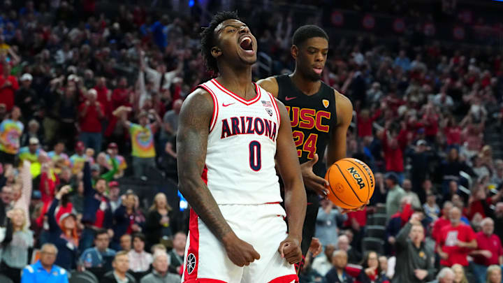 Mar 14, 2024; Las Vegas, NV, USA; Arizona Wildcats guard Jaden Bradley (0) celebrates after dunking