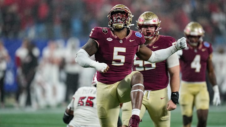 Dec 2, 2023; Charlotte, NC, USA; Florida State Seminoles defensive lineman Jared Verse (5) reacts